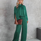 Elegante tuta verde smeraldo con maniche lunghe autunnali