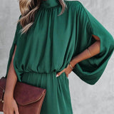 Elegante tuta verde smeraldo con maniche lunghe autunnali